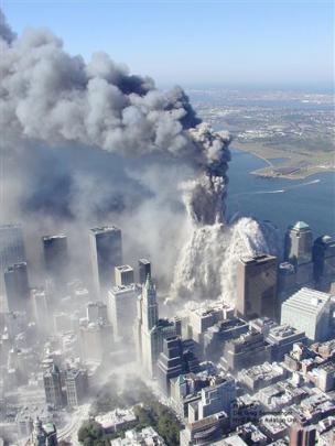 The first World Trade Centre tower begins to implode in New York, after terrorists flew two...