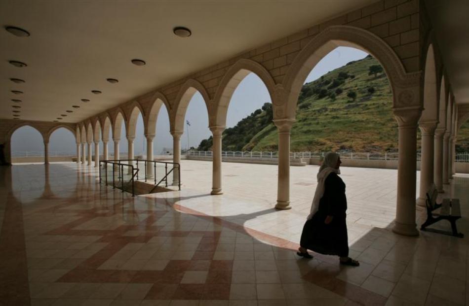 A woman walks at the Nebi Shweib holy site for Druse Arabs located on the Jesus Trail. Photo by...