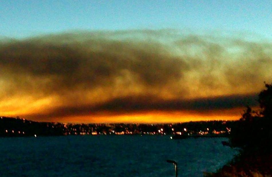 The combination of a setting sun and smoke from the fire provide a burst of colour. Reader photo...