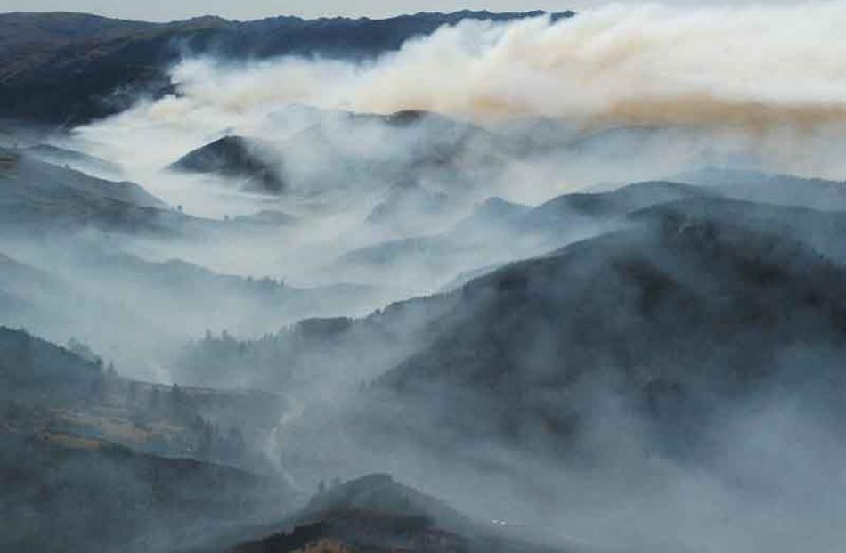 Smoke veils the Taieri Gorge valley system. Photo by Gerard O'Brien.