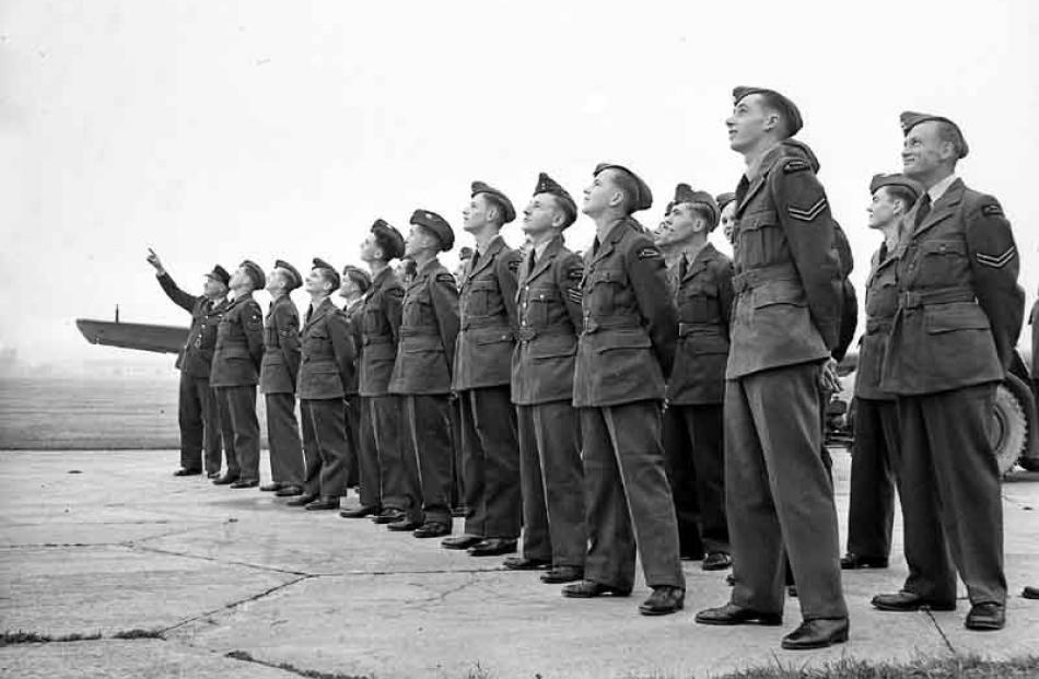 Dunedin, Balclutha and Invercargill ATC cadets look skywards at Taieri as they hear their RNZAF...