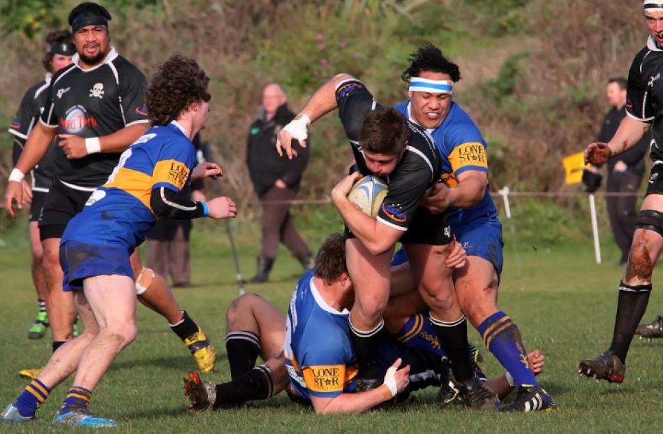 Pirates flanker Clinton Garrity steps through several Taieri tacklers during their clash at...