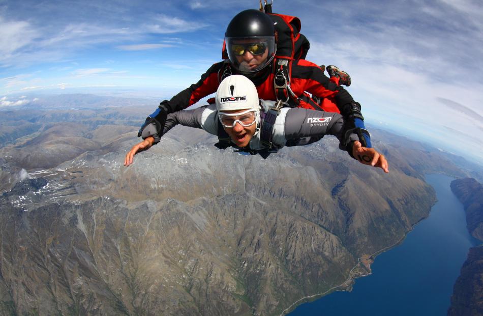 Double cancer survivor Greig Trout, of Scotland, skydives over Queenstown with NZONE Skydive...