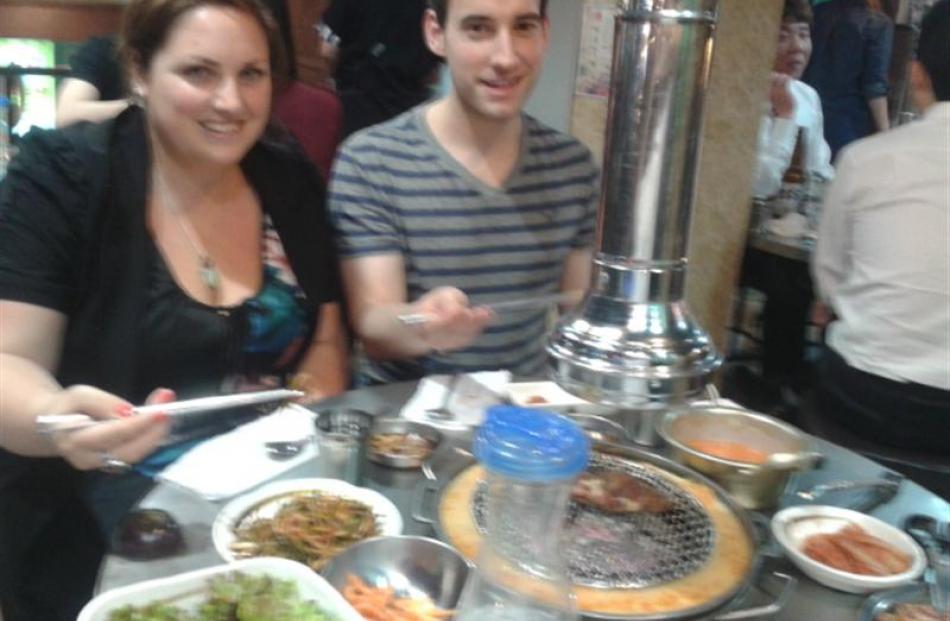 Jack Ackerman, Joong Ang Daily's cultural pages editor, and the author at a Korean BBQ restaurant.