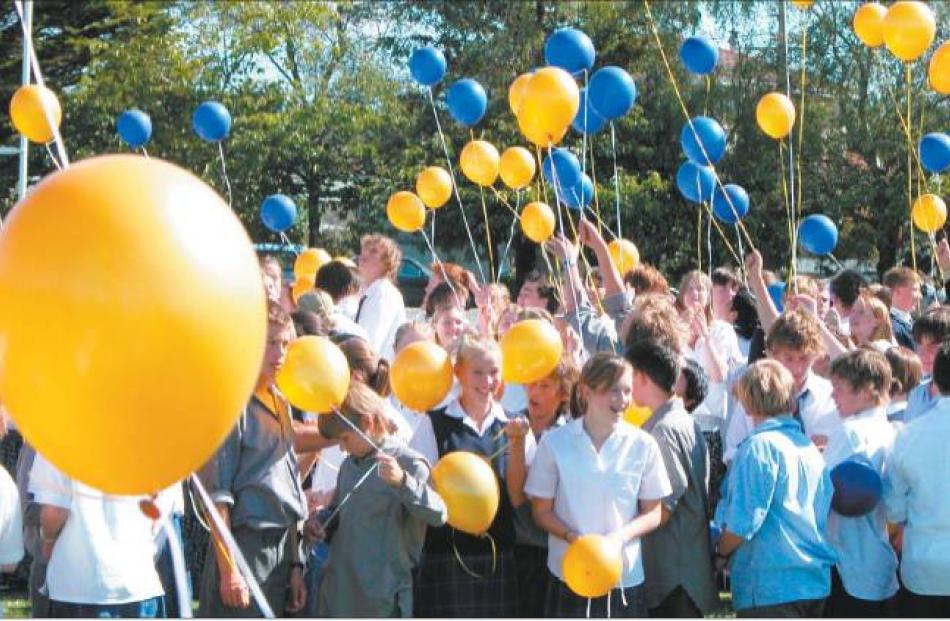 Take to the sky: Gore High School pupils with their balloons as part of the special ceremony held...