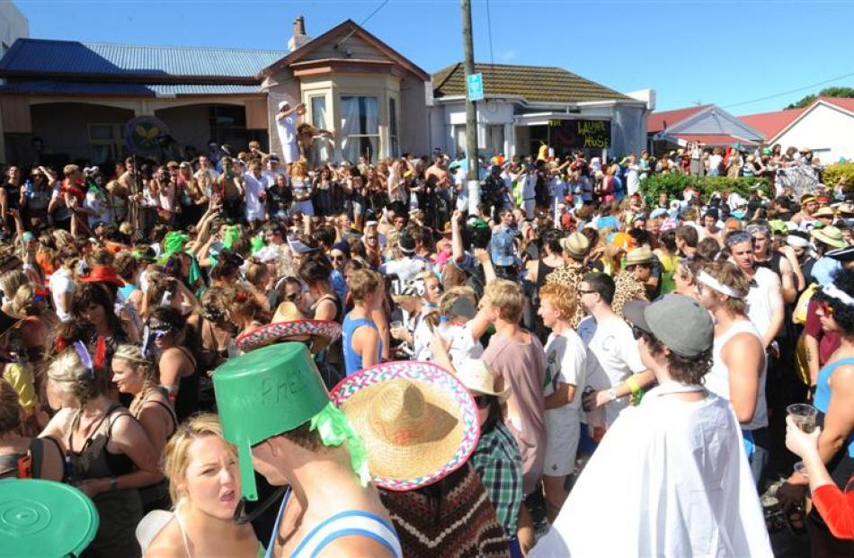 <b>2pm:</b> Revellers at the annual Hyde St keg party on Saturday.