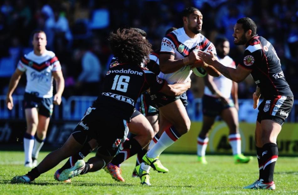 Isaac Liu of the Roosters charges forward during the round 24 NRL match between the New Zealand...