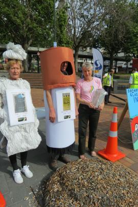 Keep Dunedin Beautiful co-ordinator Darlene Thomson (right) and volunteers dressed as chewing gum...