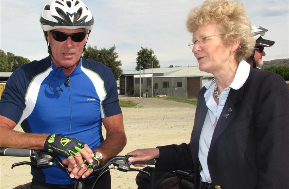 Minster of Conservation Kate Wilkinson discusses the Otago Central Rail Trail with cyclist Jeff...