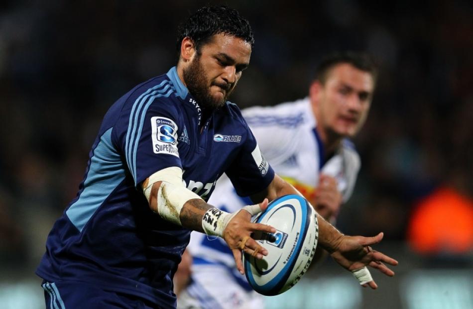 Piri Weepu of the Blues puts in a kick during the round 12 Super Rugby match between the Blues...