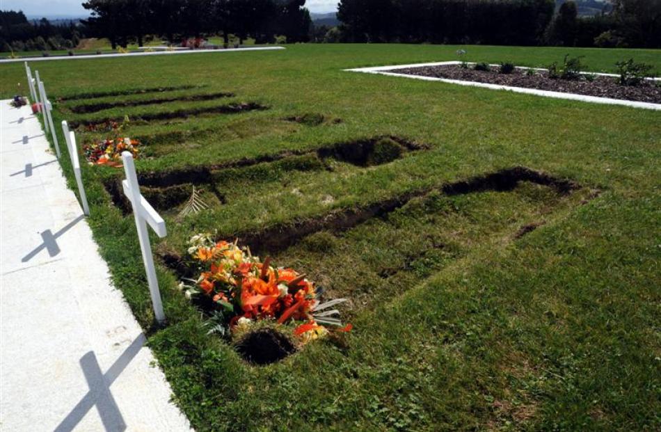 Soil will be added soon to sunken graves, including these  photographed at the Dunedin Cemetery...