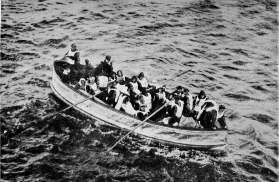 Survivors from the ill-fated Titanic: an Engelhardt collapsible boat approaching the Carpathia. -...
