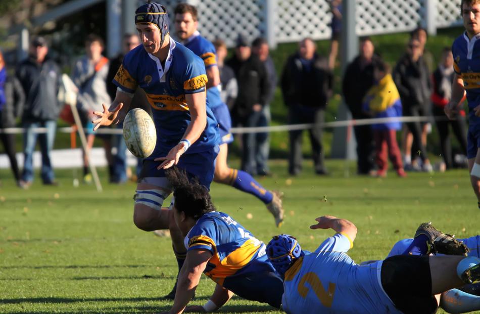 Taieri lock Mike McKee receives a pass from team mate Aki Seiuli during a Taieri attack that...
