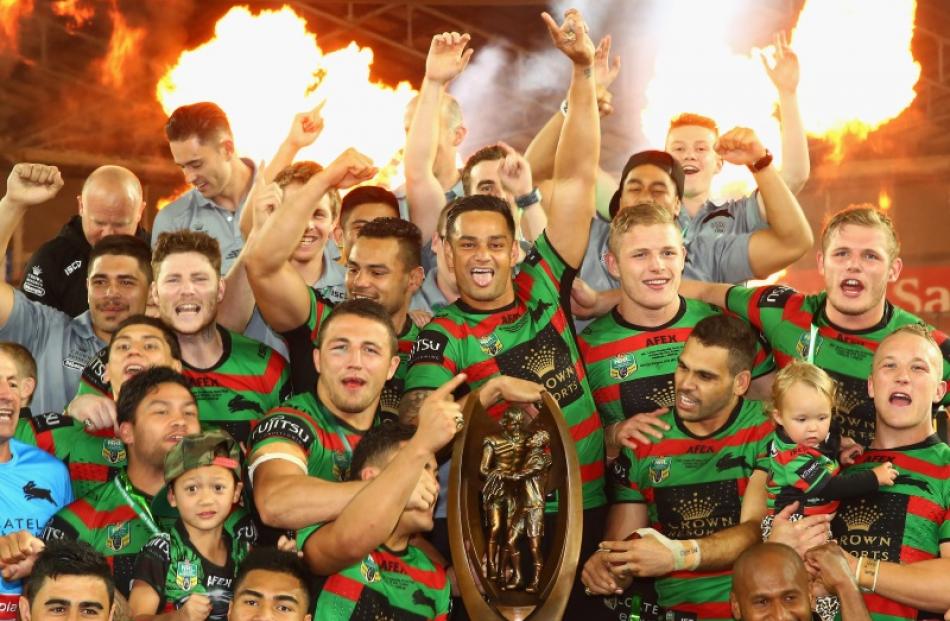 The Rabbitohs celebrate victory during the 2014 NRL Grand Final match between the South Sydney...