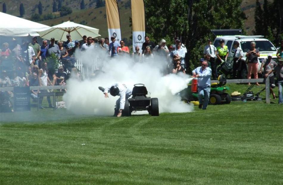 ''The Stig'' and his lawn mower are doused with a fire extinguisher after  an explosive finish in...