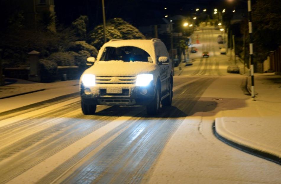 A car travels along Highgate in Dunedin this morning. Photos Stephen Jaquiery