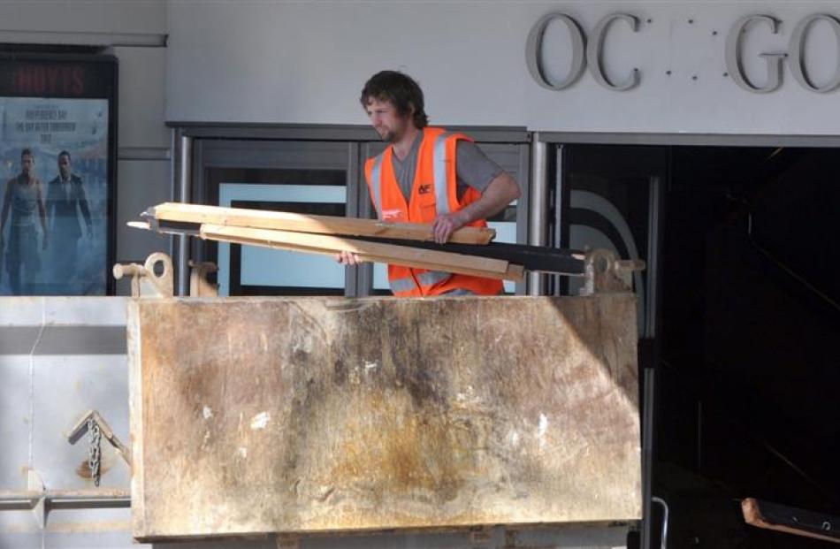 A contractor fills a skip with material from the former Hoyts cinema in Dunedin yesterday. Photo...