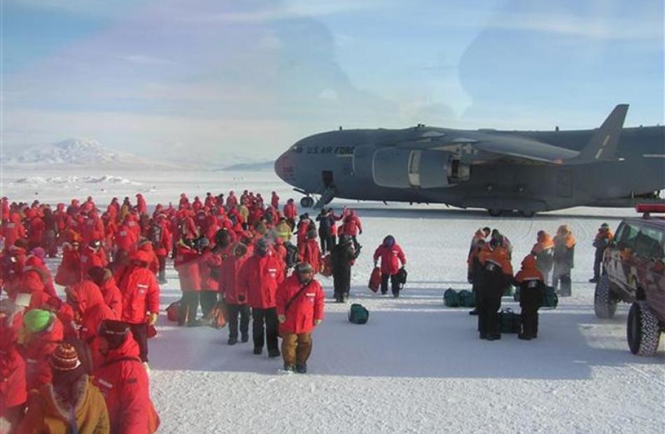 A crowded scene at the Pegasus Airfield in Antarctica after the US Air Force's huge C17...