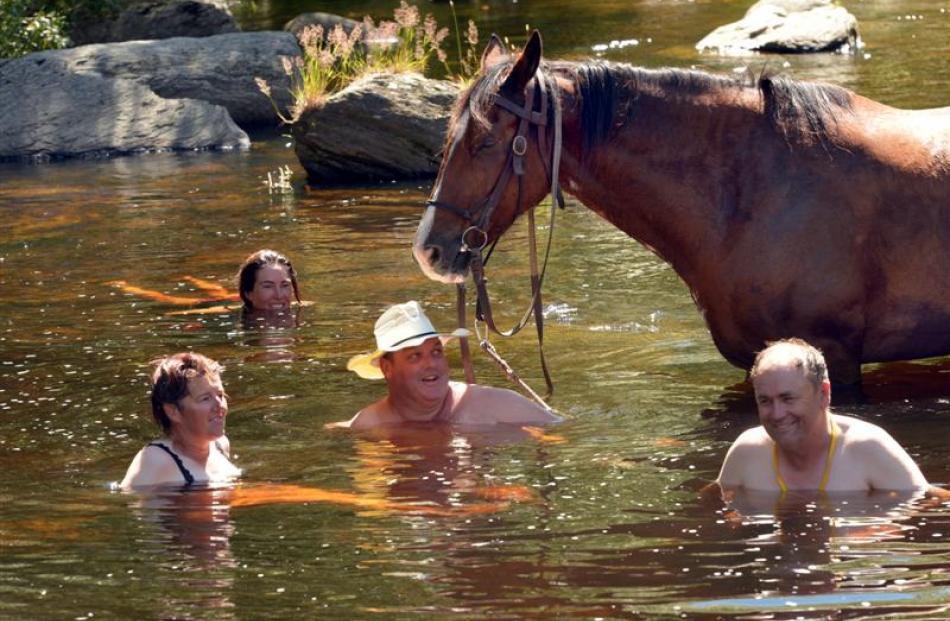 A dip in the Taieri River proves soothing for Annette O'Callaghan (Hindon), Casey Boland ...