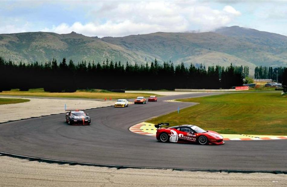 A Ferrari GT corners during practice at corner No 8 at the Highlands Motorsport Park Highlands...