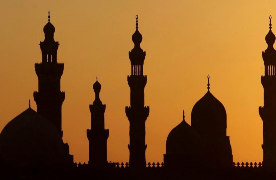 A general view of mosques during sunset in Old Cairo. Egyptians have voted on a constitution...
