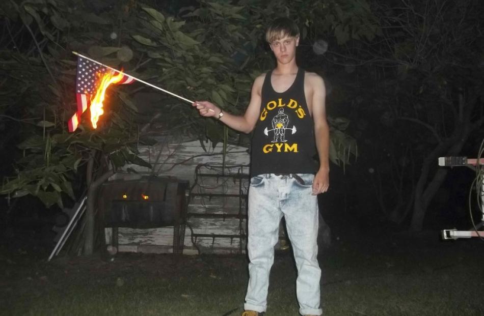 A handout photograph posted to a website with a racist manifesto appears to show Dylann Roof, the...