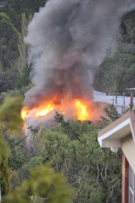 A house in the Dunedin suburb of Waverley was badly damaged by fire this evening. Reader photo by...