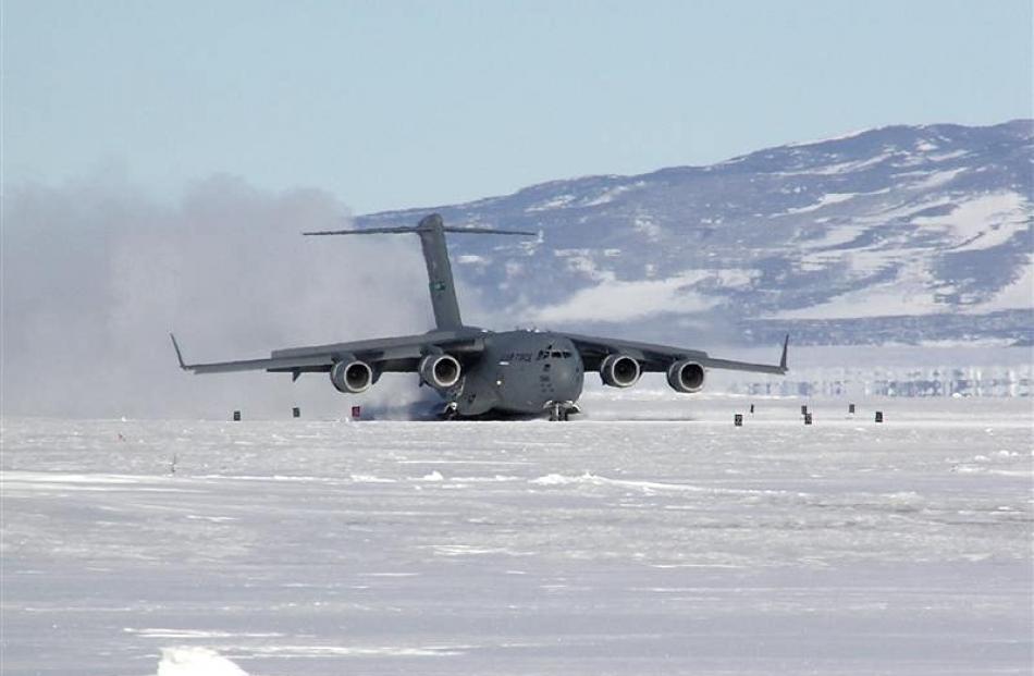 A huge C17 Globemaster 111 lands at Pegasus Airfield, near McMurdo Sound, in the Antarctic.