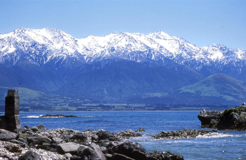A lone chimney from the whaling era stands sentinel under snowclad peaks. Photos by Paul Rush.