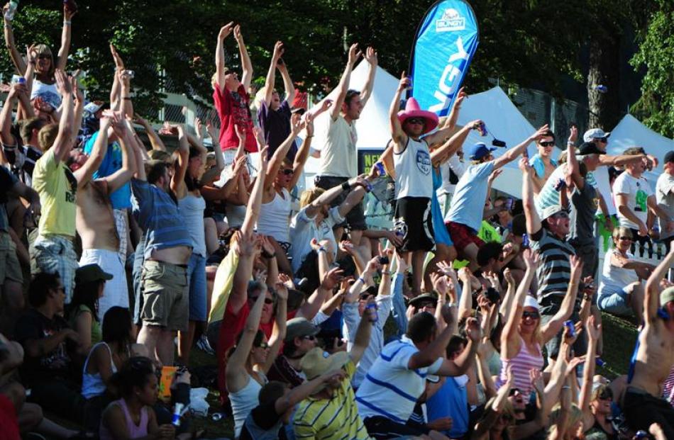 A Mexican wave goes around the crowd during the 2009 final. Photos by Craig Baxter and Tracey...