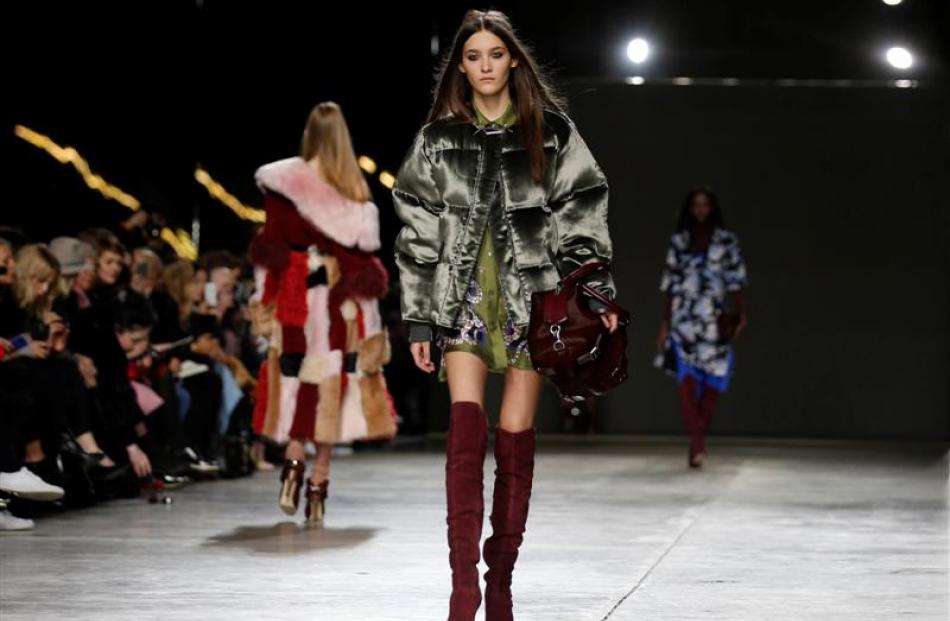A model presents a creation from Topshop Unique Autumn/Winter 2014 collection during London...