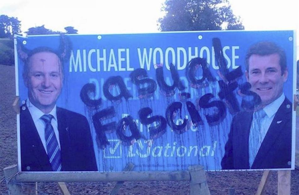 A National Party billboard featuring Dunedin North candidate Michael Woodhouse and Prime Minister...