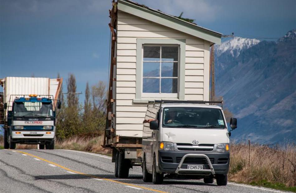 A piece  of the former Glenorchy school house is transported to a new site at Paradise, 20km away...