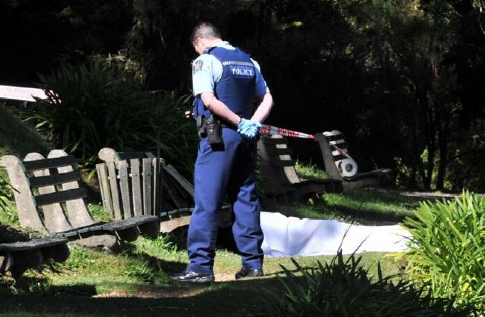 A police officer guards the site where the body of a  Dunedin man was found in the Dunedin...