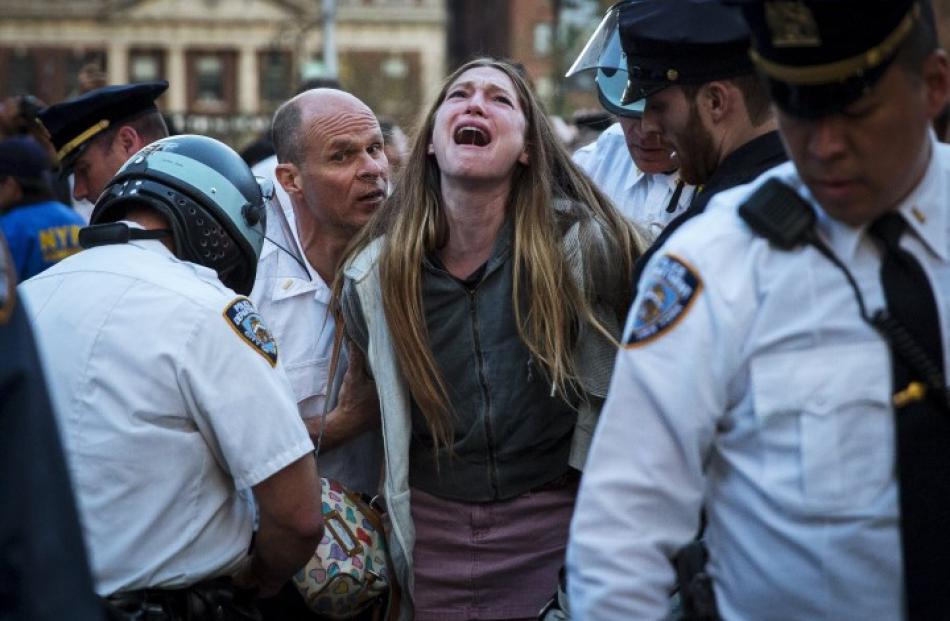 A protester is detained by New York police during a demonstration to support Baltimore's protest...
