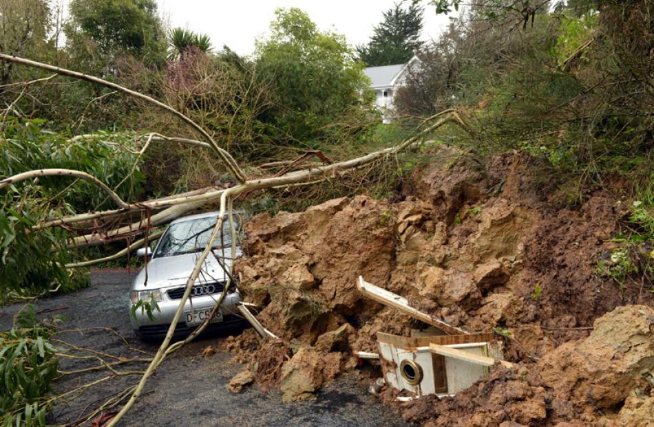 A slip in Blanket Bay, Dunedin, brought down this hillside damaging a house and car.