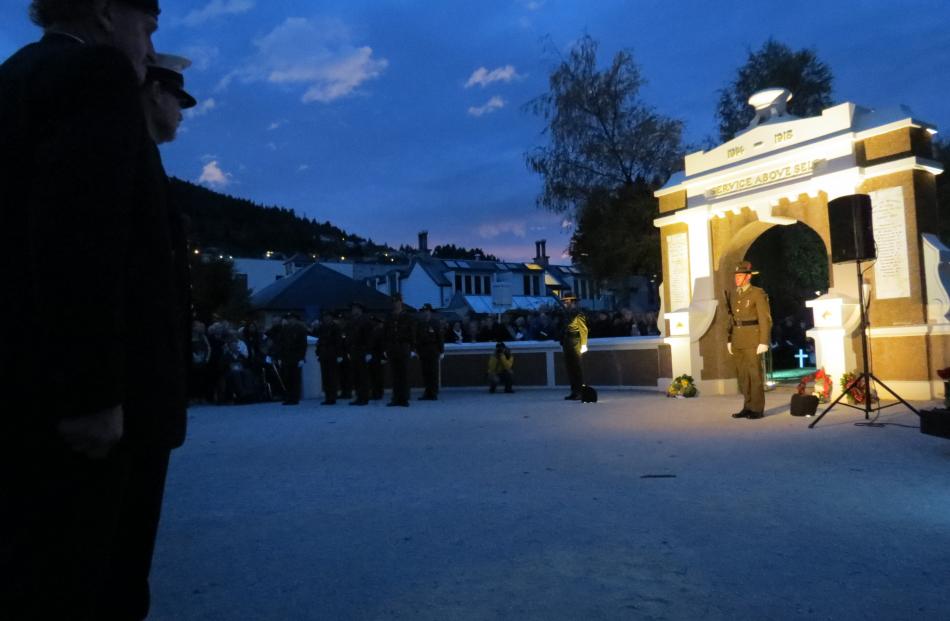 A soldier stands guard at the Memorial Gates in Queenstown on Saturday morning during the dawn...