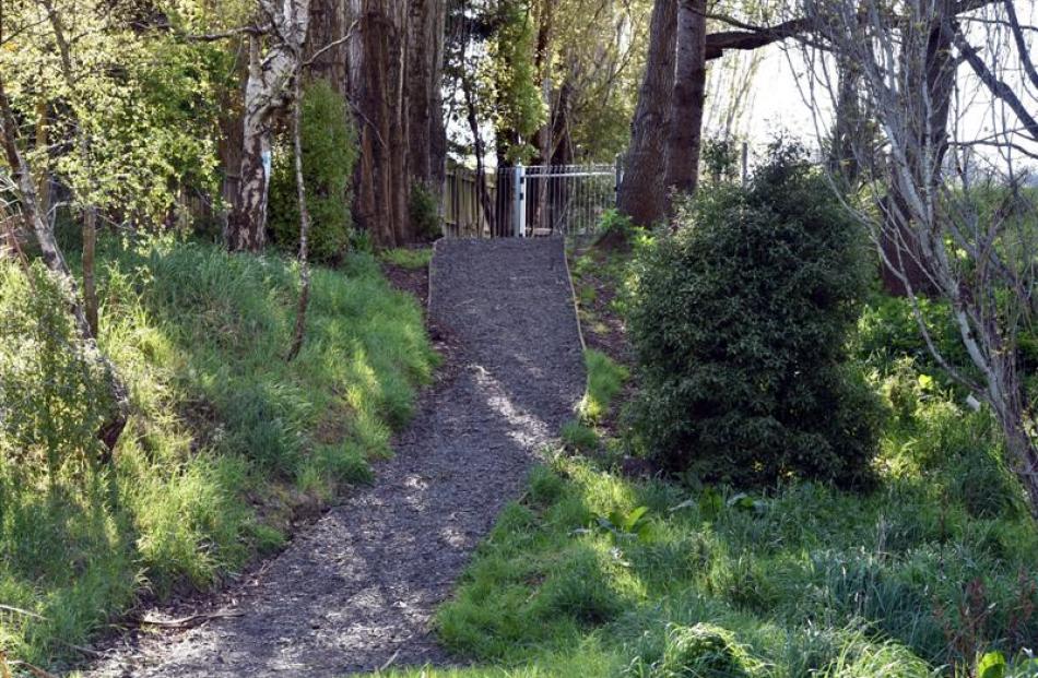 A strip of land surrounding a path leading to a gate at Abbotsford School is set to be maintained...
