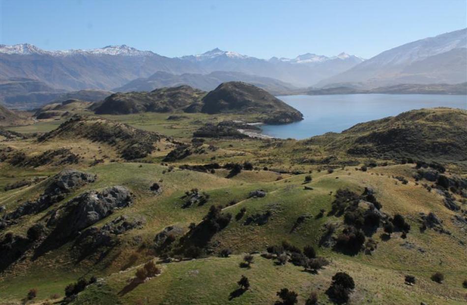 A view looking northwest from just outside Wanaka.  Black Peak is in the distance, the central of...