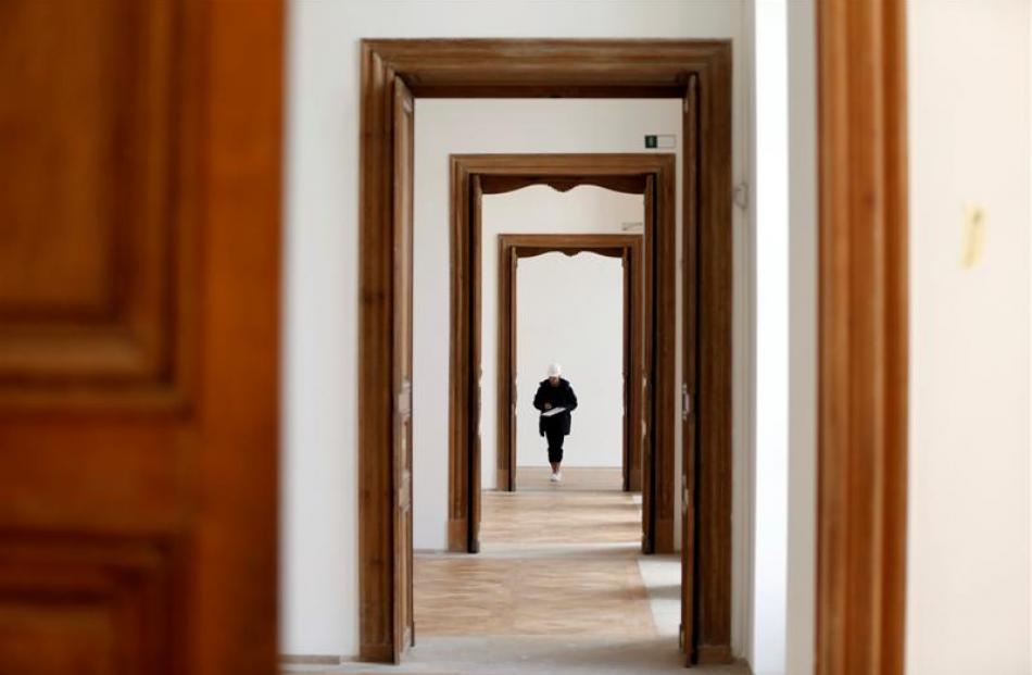 A worker puts the final touch during the renovation of the Hotel Sale known as the Picasso Museum...