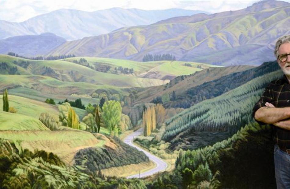 Acclaimed artist Dick Frizzell, of Auckland, stands beside The Road West to Lawrence (2012), one...