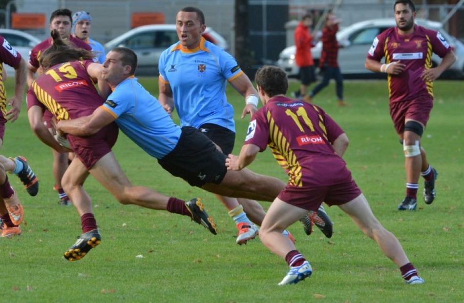Action from the University A v Alhambra-Union match (University A in blue). Photos: Gerard O'Brien