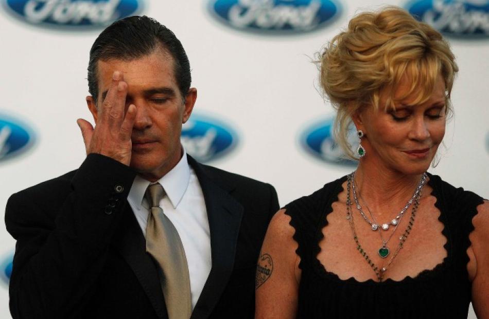 Actor Antonio Banderas and his wife Melanie Griffith attend a photocall after their arrival at...