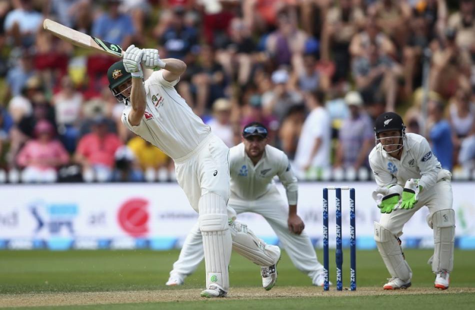 Adam Voges plays through the leg side as BJ Watling and Brendon McCullum watch on. Photo: Getty...