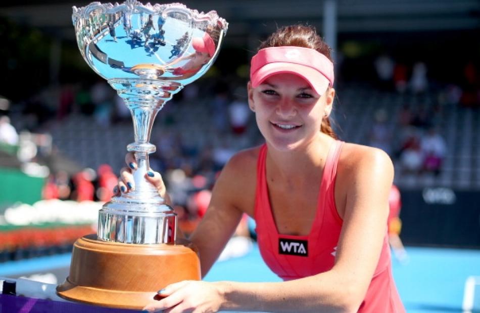 Agnieszka Radwanska of Poland holds the trophy following the final against Yanina Wickmayer of...