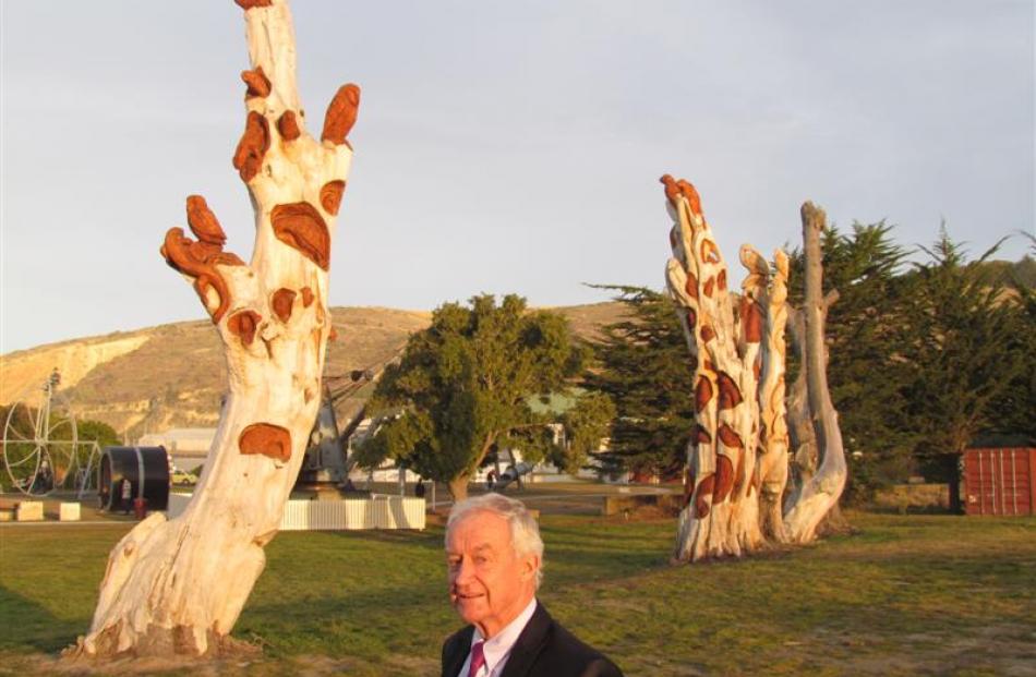 Alan McLay is appealing for funds to complete the carving of old macrocarpa trees that border the...