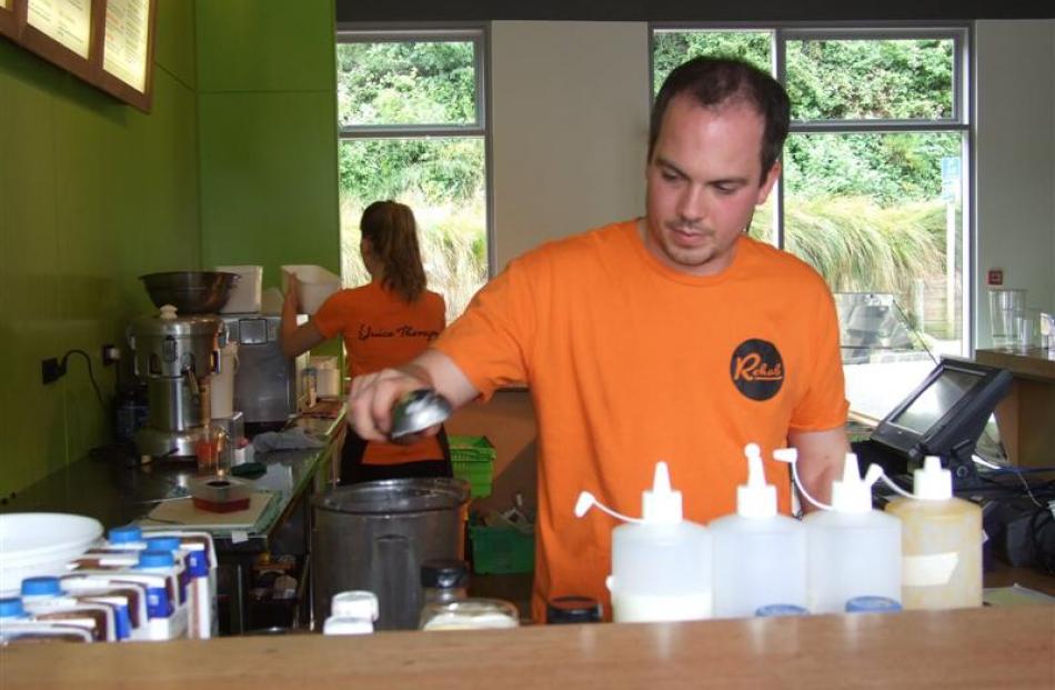 Alex Grant whips up a Frozen Monkey Relapse in the blender. Photo by Christina McDonald.
