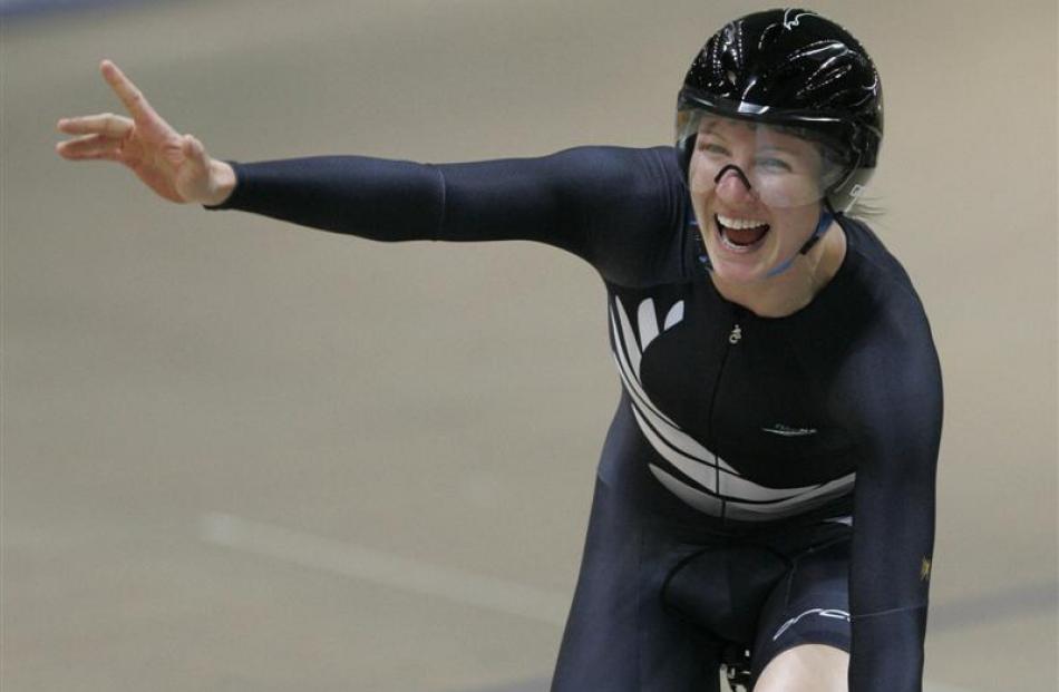 Alison Shanks celebrates winning the women's individual pursuit at the world championships in...