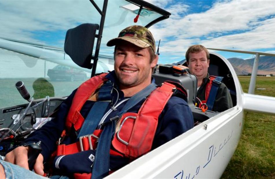 All Black captain Richie McCaw and  his cousin, Alex McCaw, prepare for a flight in the national...