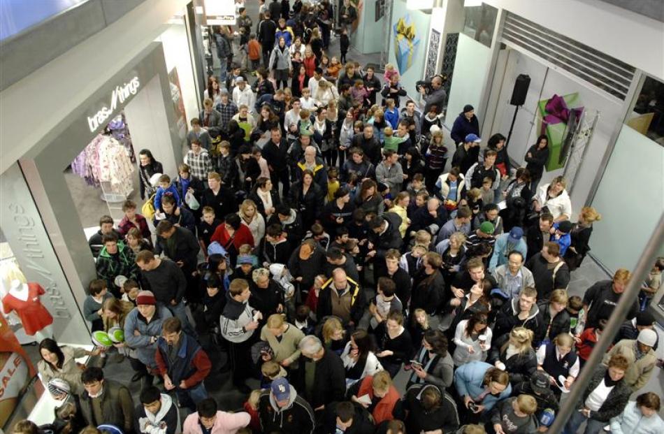 All Black fans pack the Wall Street foyer as they wait to queue for signatures. Photos by Linda...